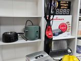 a small kitchen with a washing machine and other appliances