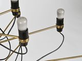 a black and gold chandelier with five lights