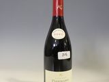 a bottle of wine that is sitting on a table