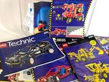 a box of lego technics on a white surface