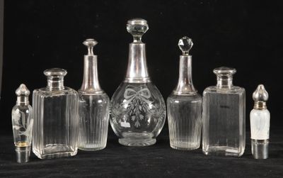 a group of glass bottles sitting next to each other