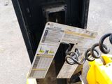 a forklift with a piece of paper stuck to it