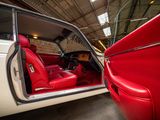a red and white car inside of a building