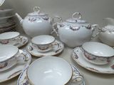 a table with a lot of plates and cups and saucers
