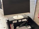 a desk with a keyboard, mouse, and monitor on it