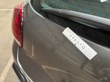 a sticker on the back of a car ' s trunk