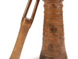 an old wooden mortar with a wooden handle on a white background