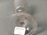 a clear glass vase with a label on it