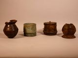 several different types of vases are sitting on a white surface
