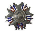 une image représentant une médaille sur laquelle figure le portrait d'un homme