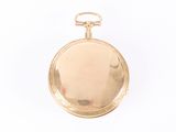 pocket watch on a white surface with a white background