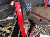 many tools in a metal box on the floor