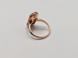 an image of a gold ring with a brown stone