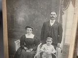 an old photo of a family posing for a picture