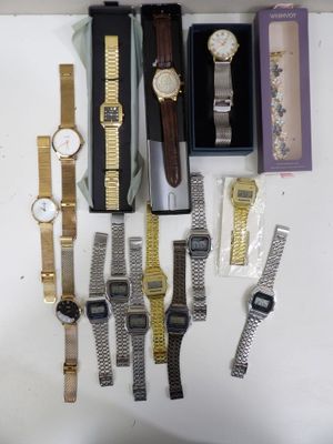 a lot of watches that are sitting on a table
