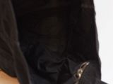 a black purse with a zipper on the inside of it