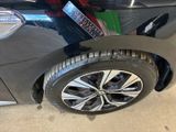 a close up of a car tire with a sticker on it