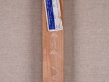 a wooden cross with writing on it on the floor