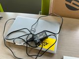 a laptop and a charger on a table