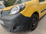 a yellow and black van parked in a parking lot