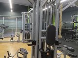 a gym with a lot of equipment in the room