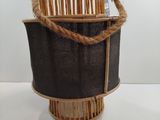 a basket that has a rope around it on a table
