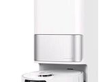 a white machine that is next to a white wall