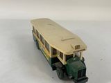 a toy bus that is sitting on a white surface