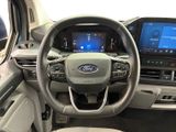 the interior of a car with a steering wheel, dashboard, and display screen