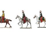 three figurines of men riding horses on a white surface