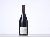 a bottle of wine that is sitting on a table