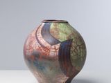 a vase that is sitting on a white table