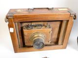 a small wooden box with a camera inside of it