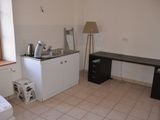 a small kitchen with a sink and a stove in it