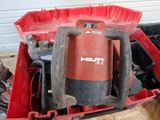 a red box with tools in it sitting on the floor