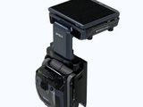 a small solar powered camera attached to a tripod
