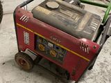 a small generator that is sitting in the garage