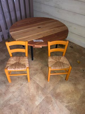 two chairs and a table in the corner of the room