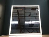 a mirror that is on a table in a room