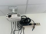 a projector that is attached to the ceiling in the room