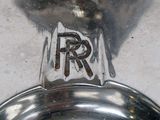 a close up of a silver plate with a logo on it