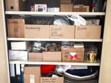 a closet full of boxes and other items in it
