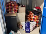 a blue door and some boxes and bags in a room