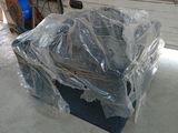 a box that is wrapped in plastic and sitting on the floor
