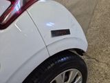 a sticker on the side of a white car