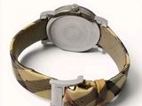 a close up of a watch on a white surface with a white background