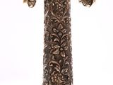 a silver candle holder with a clock on top of it