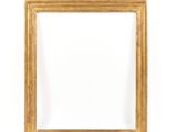 a gold frame on a white wall with a white background