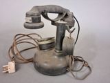 an old telephone that is sitting on a table