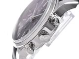 a close up of a wrist watch with a black dial